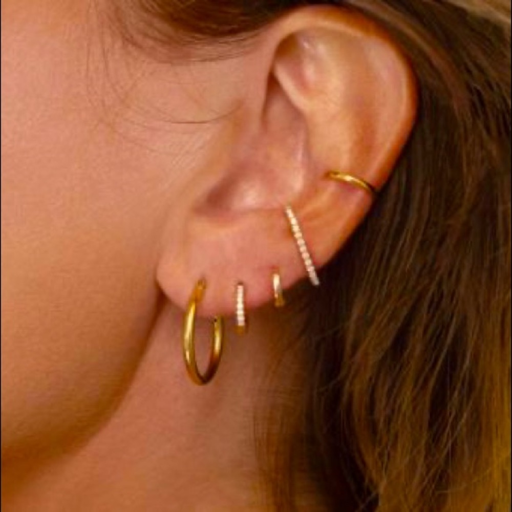Gold tone huggie hoop earrings